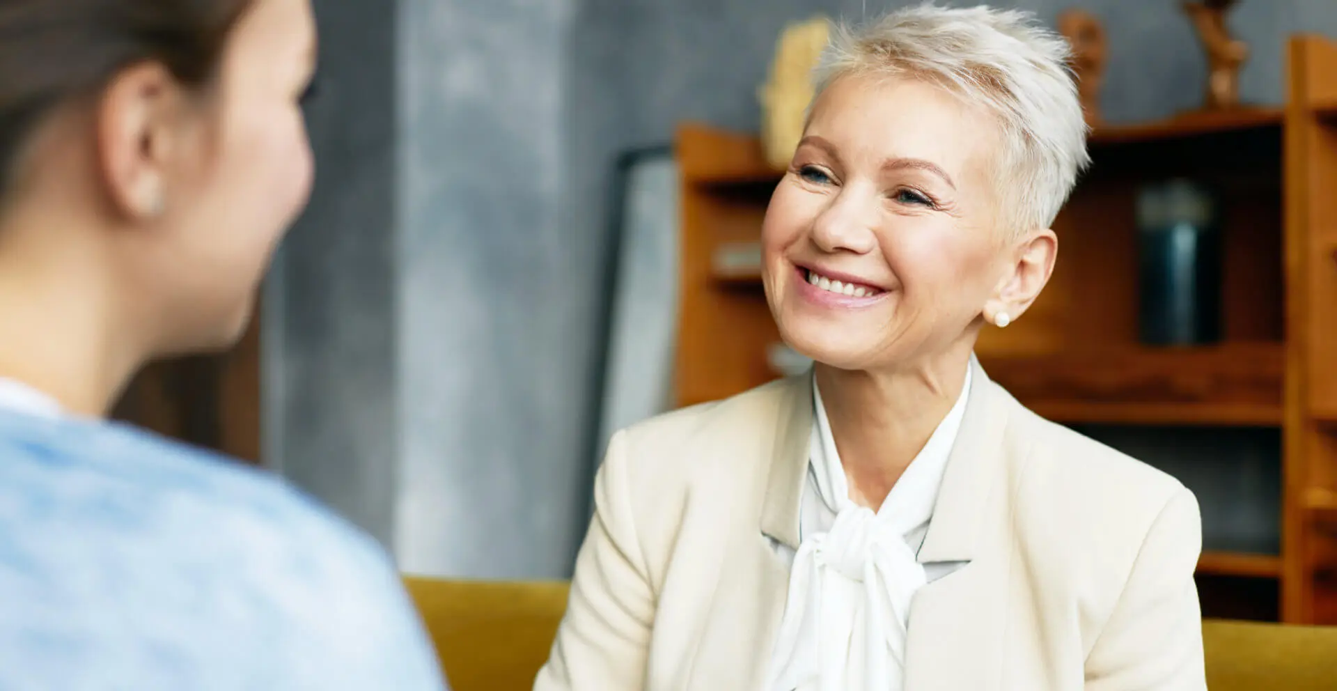 female psychological counselor with stylish haircut providing counseling assistance