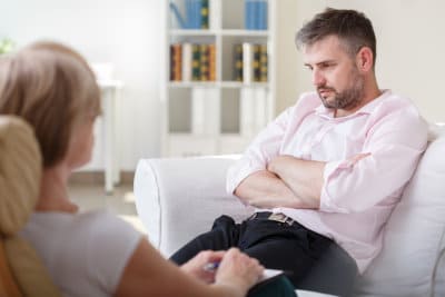therapist doing an interview with a man