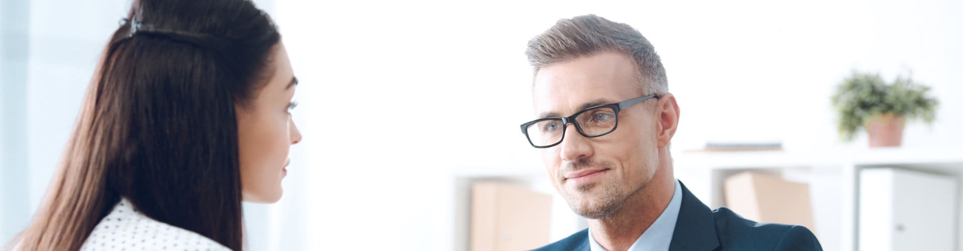 a woman talking to a lawyer